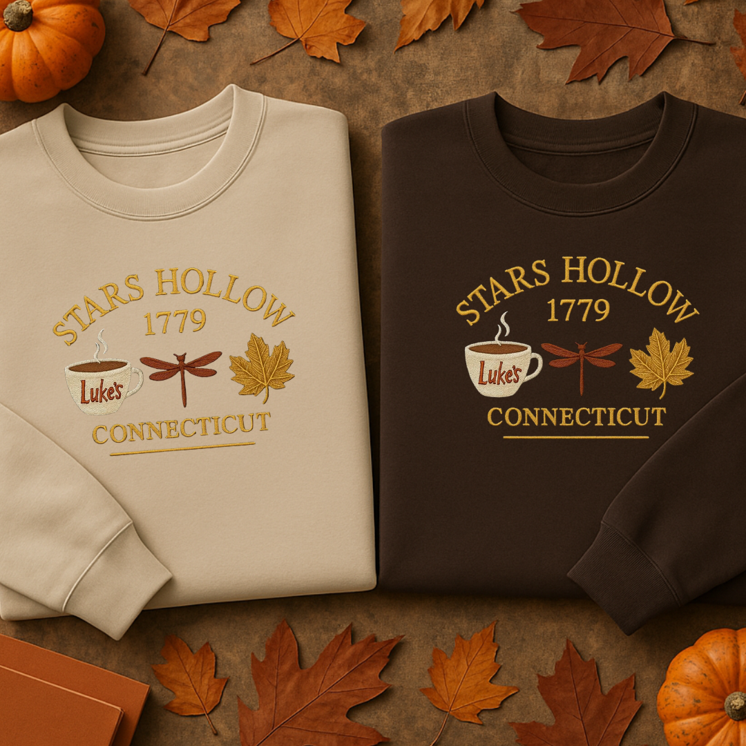 Two sweatshirts with 'Stars Hollow 1779 Luke's Connecticut' design on a brown background with pumpkins and leaves.